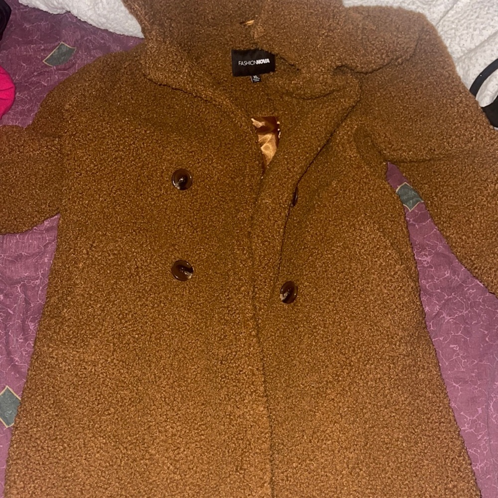 Selling a brown jacket. Never worn Size xl Good Condition Soft Material